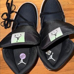 Nike Air Jordan 1 Mid in the black, white,off-noir color way Men’s size 10.5